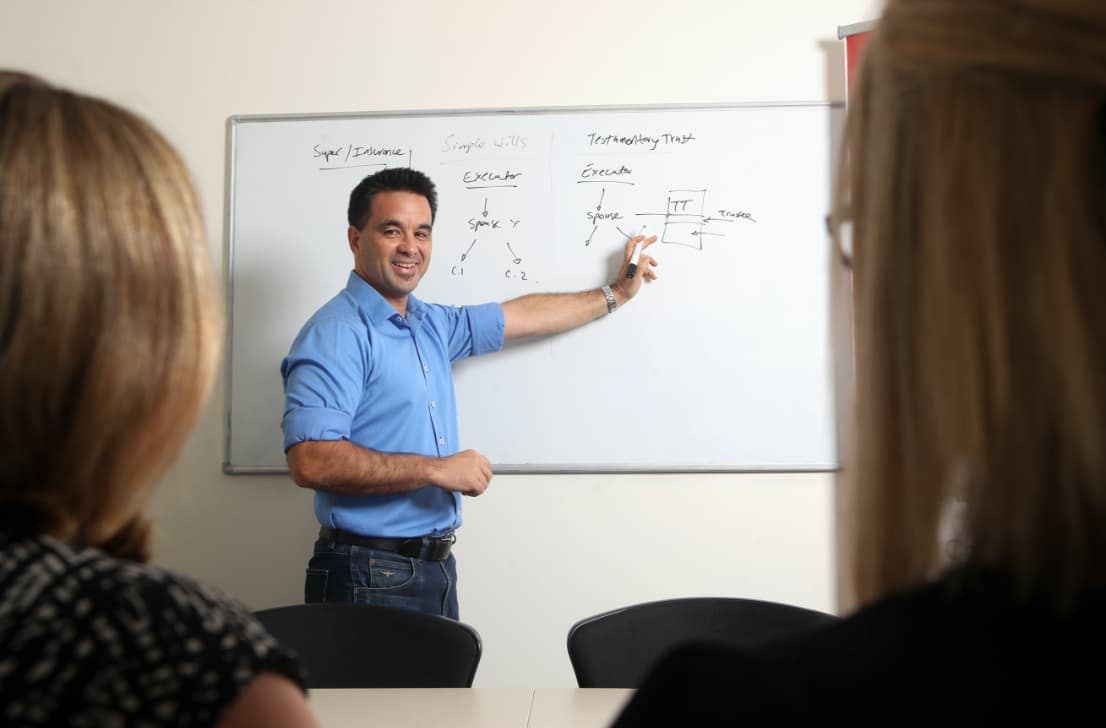 Adrian the principal lawyer writing on a whiteboard
