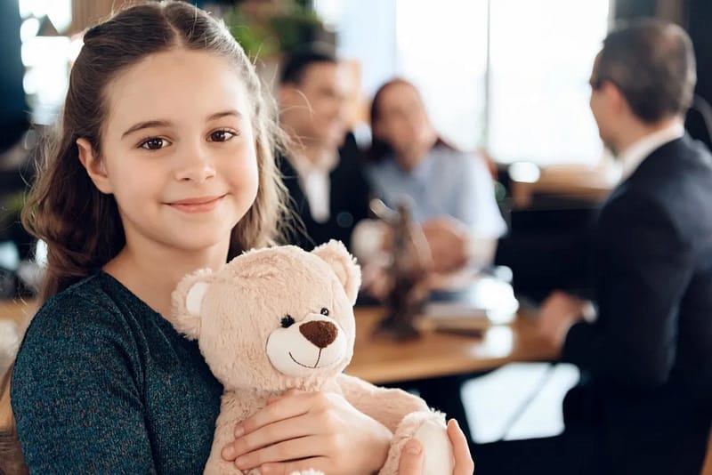 custody law image, child holding teddy bear